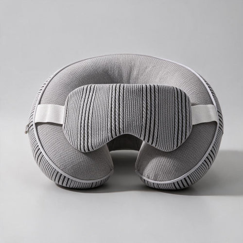 Travel Sleep System — light grey two-in-one neck pillow and eye mask, studio hero shot